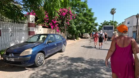 Walking-with-a-group-of-tourists-in-Tunisia's-beautiful-colourful-streets