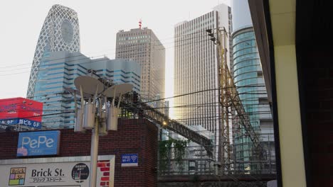 Static-Background-shot-of-Tokyo-City-on-warm-day-as-train-passes