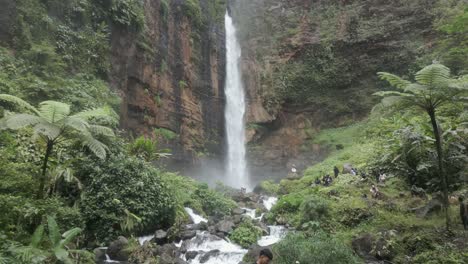 Low-aerial-pulls-in-to-powerful-Kapas-Biru-waterfall-in-Java-Indonesia