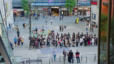 Wide-slow-motion-shot-as-young-women-line-up-for-idol-meet-and-greet-event-in-shinjuku-ward-of-Tokyo