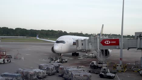 Changi-Airport,-Singapore-A350-Airplane-parked-and-docked-with-transit-tunnel,-preparation-for-flight