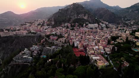 Aerial-drone-shot-over-Taormina-after-sunset-in-Sicily-island