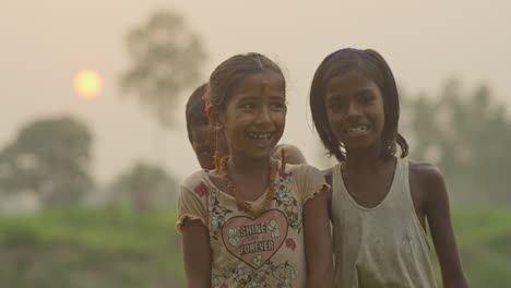 Group-of-happy-children-laughing-together-outdoor-during-sunset