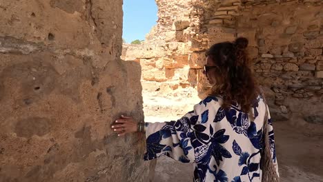 Follow-me-shot-of-the-women-in-traditional-clothes-in-the-historical-city-of-Carthage-in-Tunisia