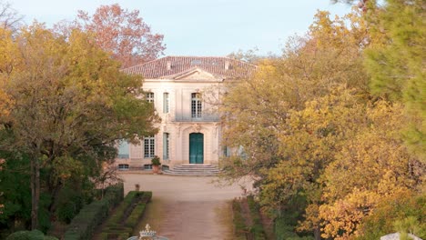 Aerial-reveal-shot-of-beautiful-architectural-french-chateau-of-l'Engarran-in-Lavèrune,-France