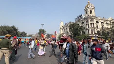 Side-view-of-protest-to-disclose-the-death-of-Netaji-Subhash-Chandra-Bose-with-vintage-buildings-at-background-in-Kolkata,-India