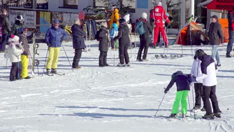 Skiers-and-non-skier-at-the-bottom-of-a-slope