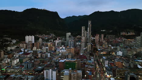 Drone-shot-passing-the-BD-Bacatá-,-dark-evening-in-Bogota,-Colombia