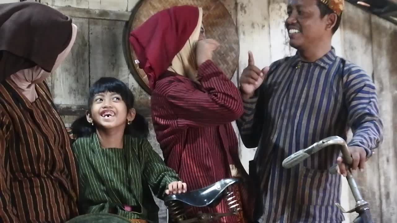 Happy Javanese Family With Their Two Children On An Ancient Bicycle ...