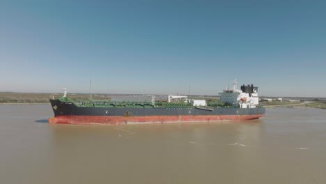 An-aerial-view-captures-the-STI-MYTHIC-oil-chemical-tanker-entering-the-Houston-Ship-Channel-on-a-clear,-sunny-day-in-Houston,-Texas