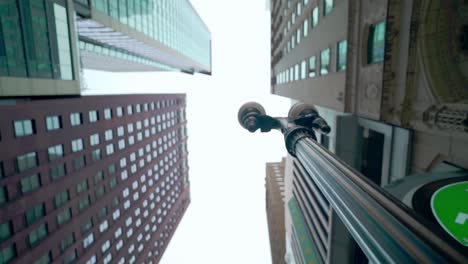 Lookup-Chicago-downtown-city-skylines-building-with-daylight-sky-in-winter-slow-motion-low-angle