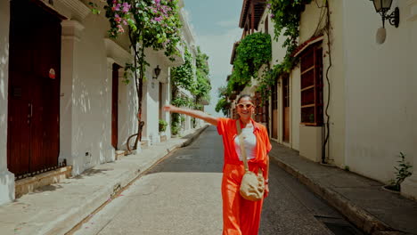 Young-female-traveler-discovering-the-empty-streets-of-Cartagena-de-las-Indias-old-historic-town