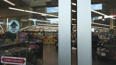 POV-shot-walking-inside-a-grocery-store-with-christmas-decor-in-Manhattan,-New-York