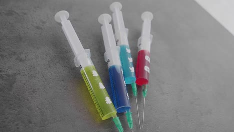 several-syringes-filled-with-colorful-liquid-symbolizing-social-media-addiction-and-the-Snapchat-Symbol-being-picked-up