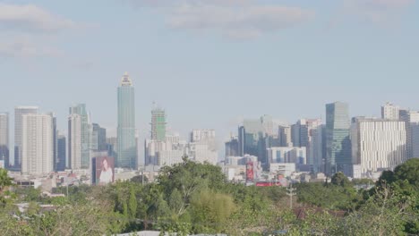 Skyline-of-Metro-Manila,-Philippines-on-a-sunny-afternoon