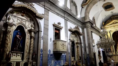 Rear-shot-of-people-attending-a-mass-inside-of-Capela-das-Almas