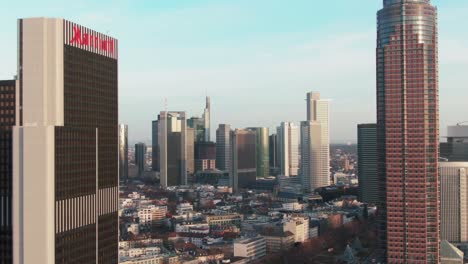 a-helicopter-flight-towards-the-Skyline-of-Frankfurt-am-Main,-Hessen,-Germany-during-golden-hour