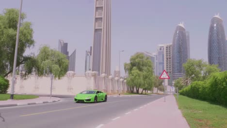 Green-Sports-Car-Racing-through-Dubai,-United-Arab-Emirates