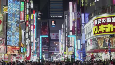 Busy-Street-with-Bright-Signage-in-Shinjuku-Tokyo,-Japan