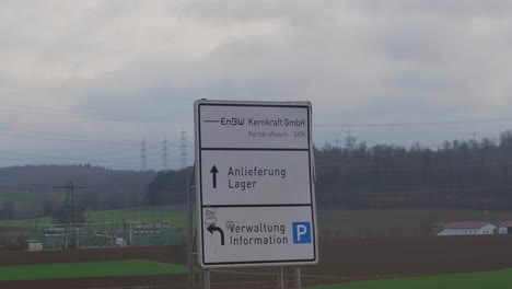 sing-in-front-of-nuclear-power-station-in-Neckarwestheim,-Germany---one-of-the-last-reaming-nuclear-power-plants-in-Germany-symbolizing-its-Atomausstieg-in-April-2023