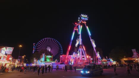 Police-Car-driving-over-ahuge-and-colorful-Festival-in-Stuttgart,-Germany