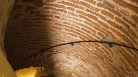 Walking-down-the-old-brick-staircase-of-the-Torre-Vigia---the-Lookout-Tower-in-the-centre-of-Cala-De-Mijas-on-the-Costa-Del-Sol-in-Southern-Spain