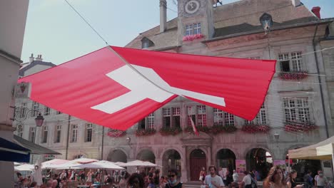 City-Centre-of-Lausanne,-Switzerland-with-a-swiss-flag