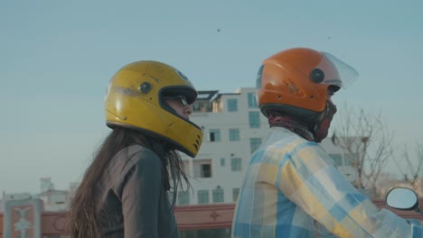 An-Ola-Cab-Driver-or-Uber-Driver-on-a-motorbike-transporting-a-customer-through-the-busy-streets-in-south-east-asia-and-india