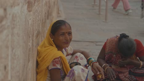 Group-Of-Indian-Women-On-The-Street-In-India-Dressed-In-Traditional-Orange-Saris-With-Transition