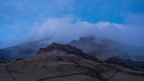 4K-Time-lapse-of-Iztaccihuatl-Volcano-with-clouds-and-snow-at-sunset