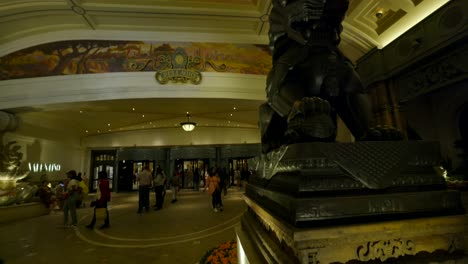 Lion-Sculpture-At-Entrance-Lobby-Of-Bellagio-Hotel-And-Casino-At-Night-In-Las-Vegas,-Nevada