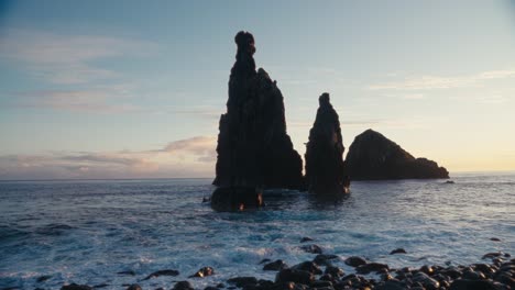 Huge-waves-hit-the-rocks-on-the-coast-of-Madeira-while-there-are-lonely-rock-formations-in-the-middle-of-the-ocean,-sea