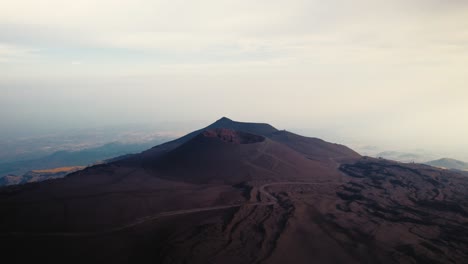 Drone-flying-over-a-volcano-crater-at-Mount-Etna,-Sicily