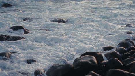 waves-splashing-on-rocks-on-the-beach-of-Madeira