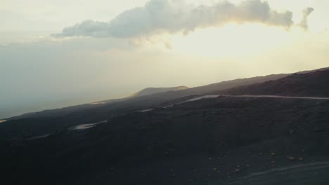 Drone-flying-over-a-volcano-crater-at-Mount-Etna,-Sicily