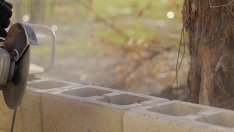 Worker-Cut-Concrete-Brick-With-Circular-Saw-Blade-Making-Dust