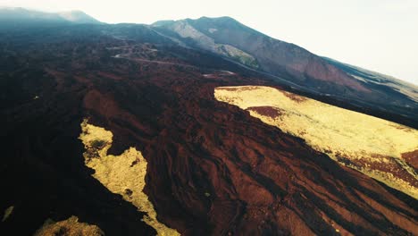 Drone-flying-over-a-volcano-crater-at-Mount-Etna,-Sicily