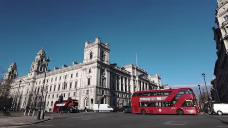 Intersection-at-Parliament-Square-in-Westminster,-London,-England,-featuring-bustling-street-traffic