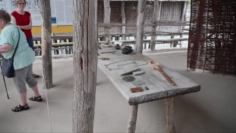 Tourists-viewing-ancient-tools-display-at-Ice-Age-museum-in-Friedrichshafen