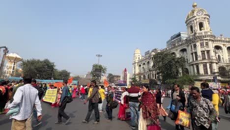 Closeup-view-of-protest-to-disclose-the-death-of-Netaji-Subhash-Chandra-Bose-in-Kolkata-with-other-people-crossing-road