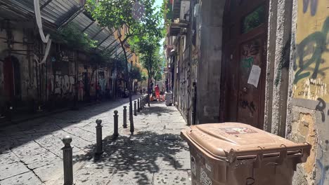 POV-shot-of-walking-street-with-graphite-to-the-city-centre-of-Naples-in-Italy