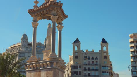 Tilt-shot-of-the-Statue-on-Puente-del-Mar-on-a-sunny-day-in-the-city-of-Valencia-in-Spain