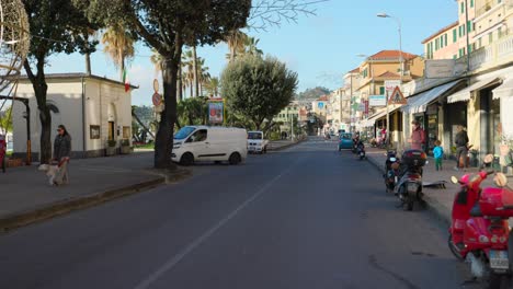 Daytime-scene-crossing-the-street-in-Varazze,-a-seaside-town-in-the-Italian-Riviera