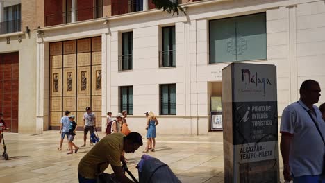 Tourists-walking-and-enjoying-the-streets-of-the-historic-center-of-the-Andalusian-city-of-Malaga,-Spain