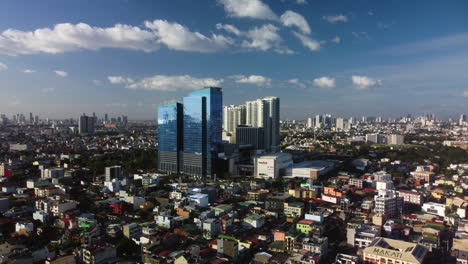 Panoramic-drone-shot-circling-the-Ayala-Malls-Circuit,-golden-hour-in-Philippines