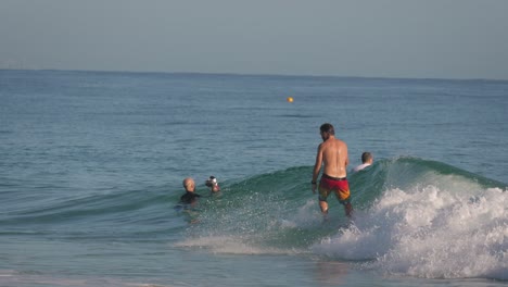 Surfer-enjoying-a-clean-wave-on-a-calm-sunny-day-at-Snapper-Rocks,-Gold-Coast