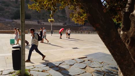 Tourists-walking-through-the-streets-of-the-historic-center-of-Malaga,-Andalusia,-Spain