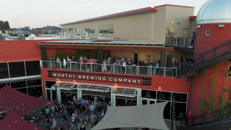 Establishing-shot-of-the-Worthy-Brewing-Company-with-a-full-patio