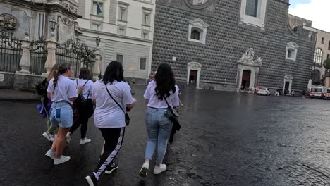 A-young-bride-with-her-friends-walking-near-the-castle-with-a-big-plastic-toy