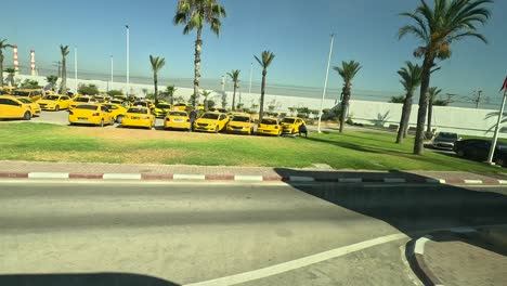 View-from-the-bus-window-on-the-yellow-taxi-parking,-going-to-the-city-centre-from-the-Tunis-cruise-port